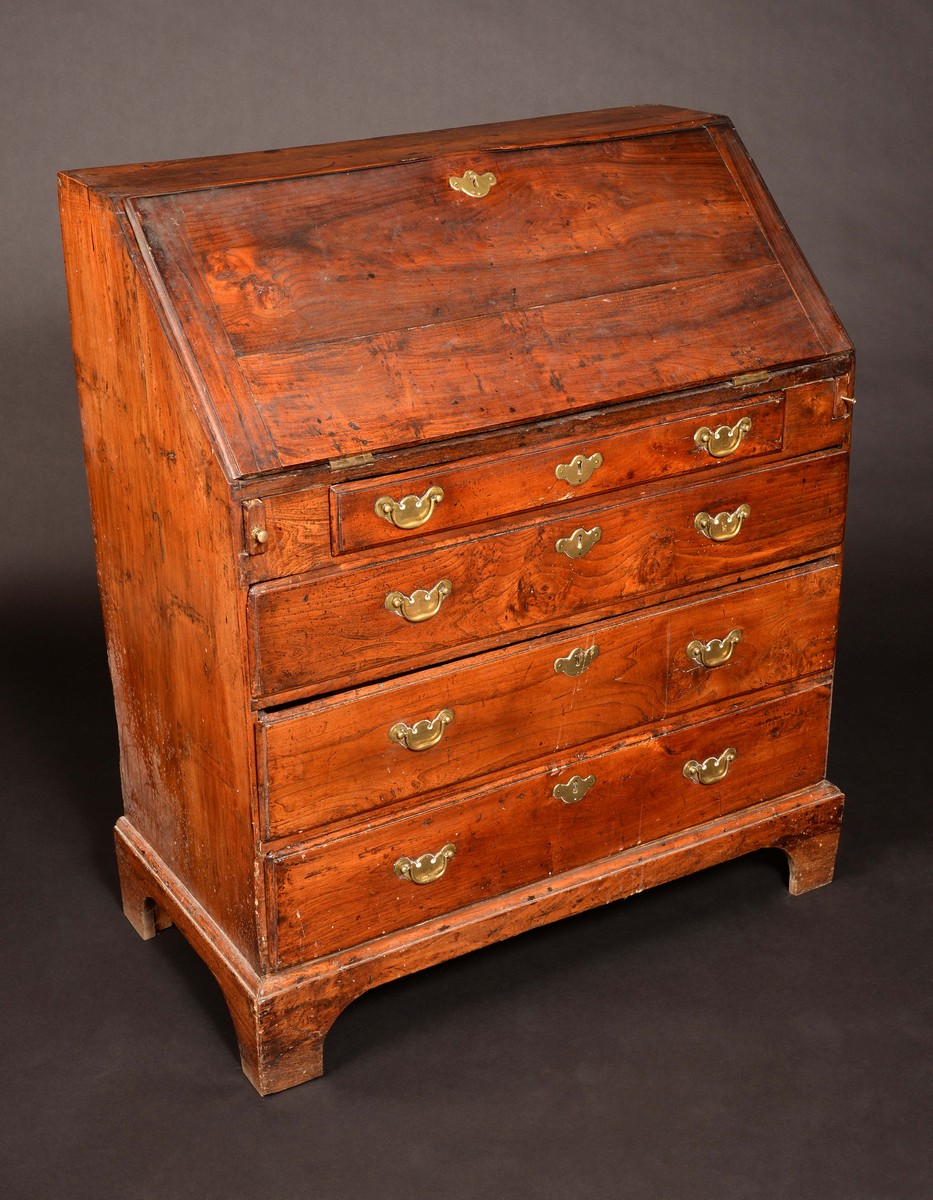 An early 18th century bureau, the fall front with fitted interior and well,