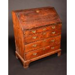 An early 18th century bureau, the fall front with fitted interior and well,