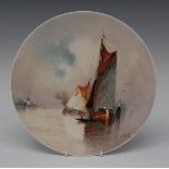 A Minton circular plate, painted by J E Dean, signed and signed again to sails and dated 1926,