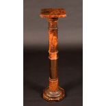 An early 20th century marbled alabaster statuary pedestal, canted square top, turned column,