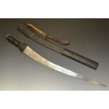 A Sudanese sword, 71cm blade engraved with foliate curves, tooled leather grip and scabbard,