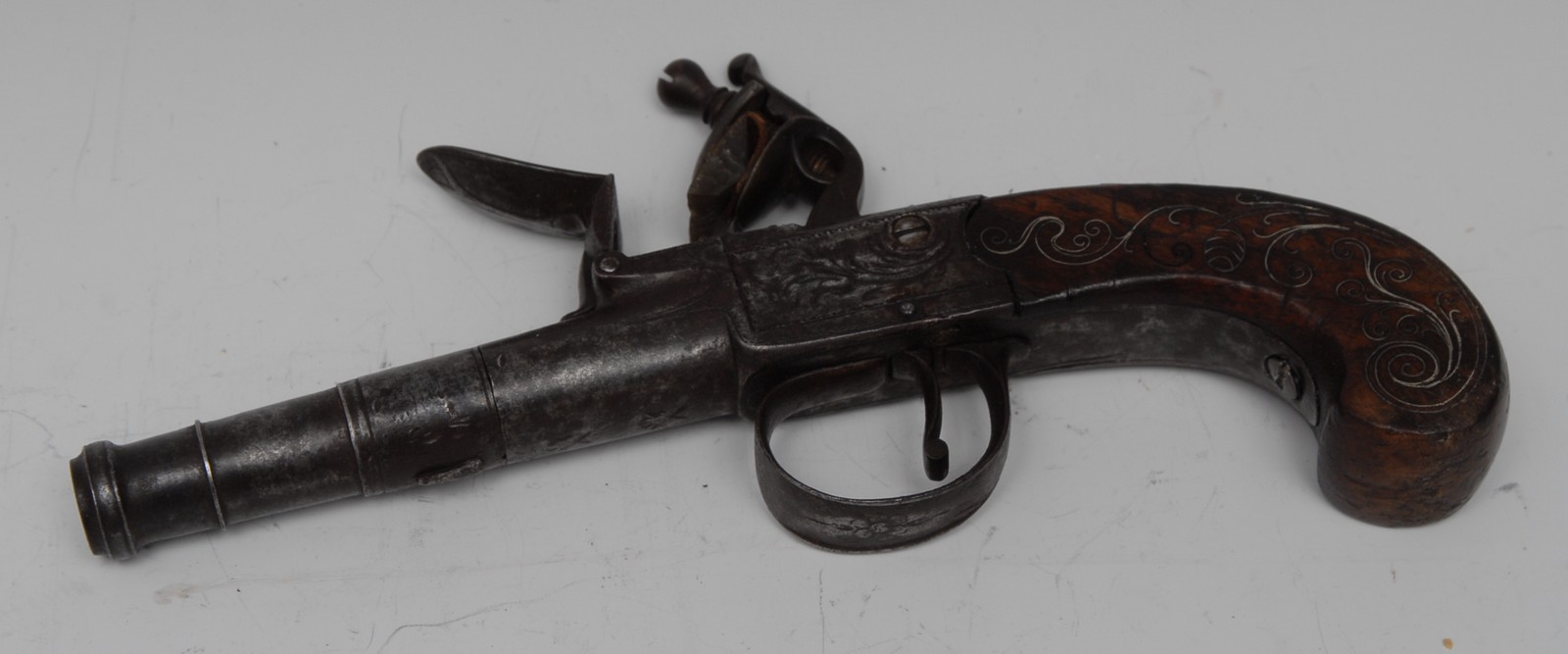 A George III flintlock pocket pistol, 6cm screw-off barrel, the lockplate signed Rylands & Darby,