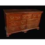 A George III mahogany Lancashire chest, hinged top above three blind and four moulded drawers,