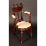 An unusual late Victorian mahogany elbow chair,