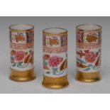 A garniture of three Spode Imari cylindrical vases, decorated with peonies and foliage,