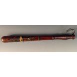 A Victorian turned and painted truncheon, decorated in polychrome with crowned VR cypher, ring grip,