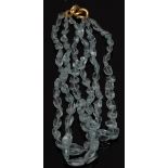 An aquamarine three strand polished pebble bead necklace,