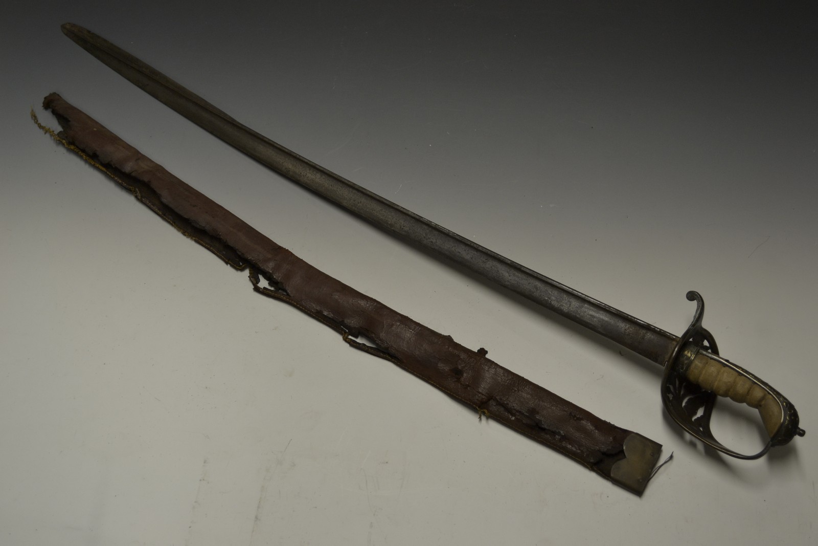 A 19th century infantry officer's sword, 82cm slightly curved single-edged fullered blade,