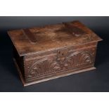An early 18th century oak rectangular bible box, hinged cover with notched border,
