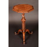 A Victorian walnut tripod occasional table, octagonal top with shallow gallery,