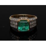 An emerald and diamond ring, central cushion cut emerald approx 2.