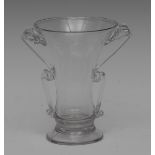 An early 18th century two-handled glass syllabub glass, waisted elongated bowl,
