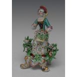 A Bow figure, Allegorical of Spring, modelled with a girl in fancy dress,