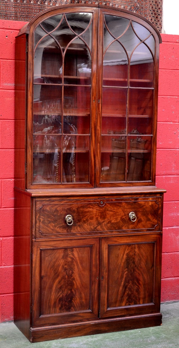 A mahogany domed topped secretaire bookcase, astragal glazed doors enclosing shelving to top,