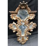 A 19th century giltwood and gesso cartouche shaped looking glass,