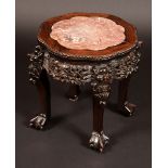A Chinese padouk wood shaped circular jardiniere stand,