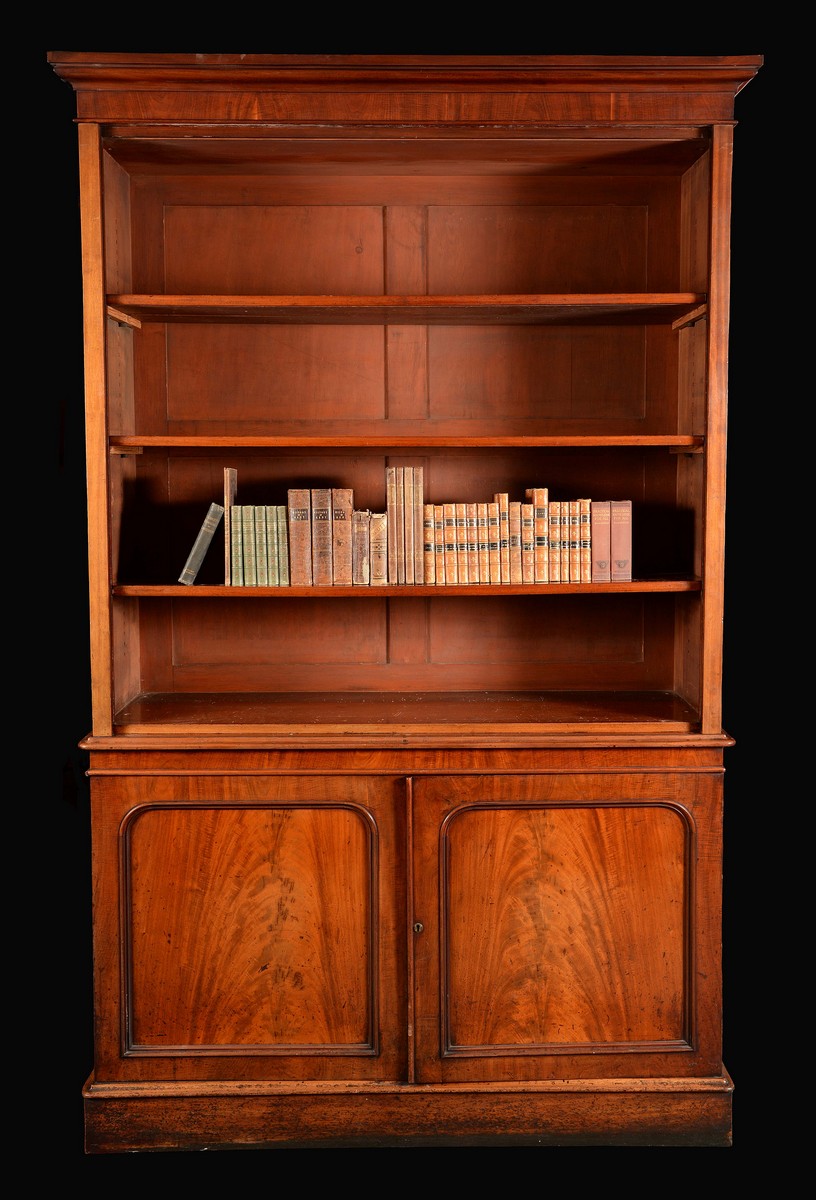 A Victorian mahogany library bookcase, moulded outswept cornice above open adjustable shelves,