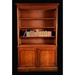 A Victorian mahogany library bookcase, moulded outswept cornice above open adjustable shelves,