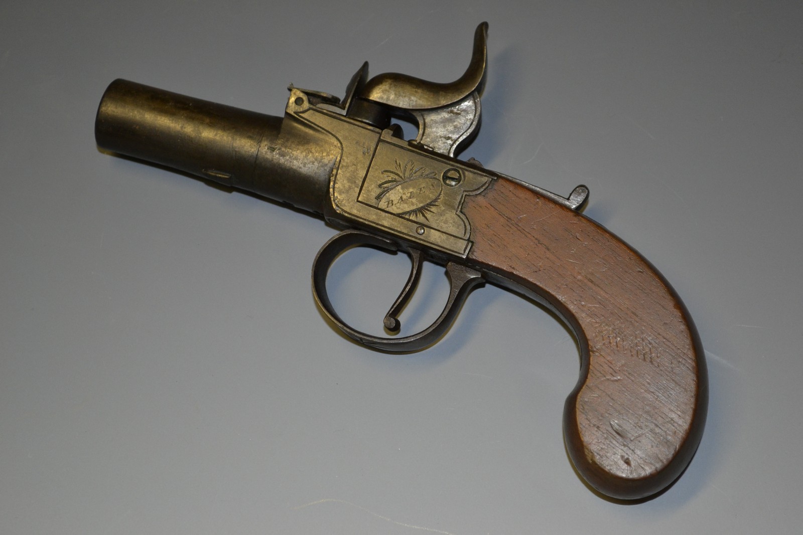 A Regency percussion pocket pistol, 4cm screw-off barrel, the lockplate signed Bales, Ipswich,
