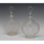 A pair of 20th century cut glass Moon Flask decanters and stoppers,