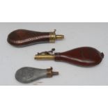 A 19th century copper and brass powder flask, beaded border, stamped Sykes, 20cm long; another,