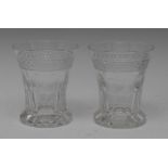 A pair of late 19th century clear glass waisted cylindrical The Last Drop tumblers,