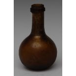 A 17th/early 18th century glass globular onion bottle, of small proportions, shallow kick to base,