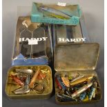 Two pairs of Hardy fishing rod clamps; various spinners; Devon spoons; Minnows; lures; etc.