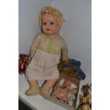 A mid 20th century composite doll; an early 20th century jointed doll,
