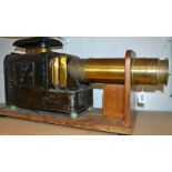 A Victorian lacquered brass and black painted Magic Lantern, 37cm barrel with retractable cover,