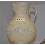 A Victorian relief moulded stoneware jug, diamond registration mark, c.
