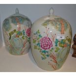 A pair of contemporary Chinese ginger jars and covers decorated with fanciful birds perched on