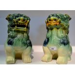 A pair of contemporary glazed pottery Temple Lions
