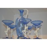 Glassware - a blue glass ewer and champagne coupes,