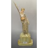 An Art Deco type figure of a dancing lady on a onyx base