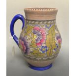 A Charlotte Rhead tube lined jug of typical design.