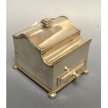 An unusual George III Sheffield Plate inkstand, hinged serpentine cover enclosing a glass well,