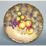 An Edwardian china cabinet plate, painted with ripe fruits.