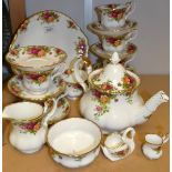 A Royal Albert Old Country Roses tea service for six comprising teapot, cake plate, side plates,