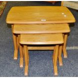 An Ercol nest of three graduated coffee tables,