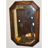 A 1930s shaped rectangular oak framed mirror ,