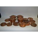 Copper - four twin handled saucepans and covers;