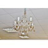 A 20th century clear five light, five arm ceiling chandelier,