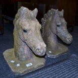 A pair of reconstituted stone Horse heads