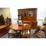 A 20th century Bridgecraft dining suite comprising of , a dresser, glazed top ,
