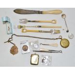 Ephemera - a gold coloured metal fob case; lighter with inset shilling; vesta case; fish knives;