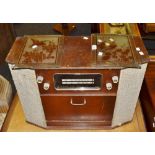 A vintage radio and record player, a pair of acid etched glass panels,