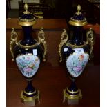 A pair of Sevres style gilt metal mounted mantel vases