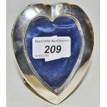 A silver heart shaped easel photograph frame, London,