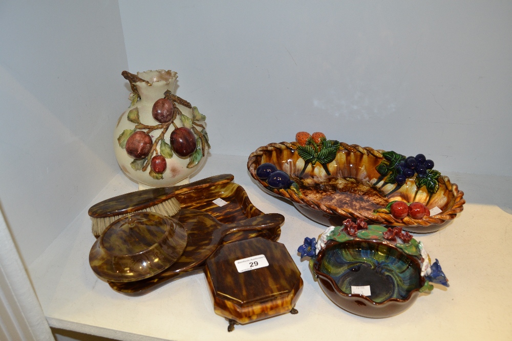 An early 20th century faux tortoiseshell dressing table set; an Austrian majolica shaped oval dish,